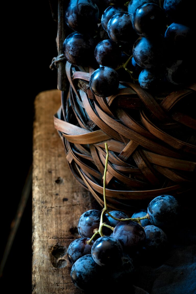 dark grapes on basket